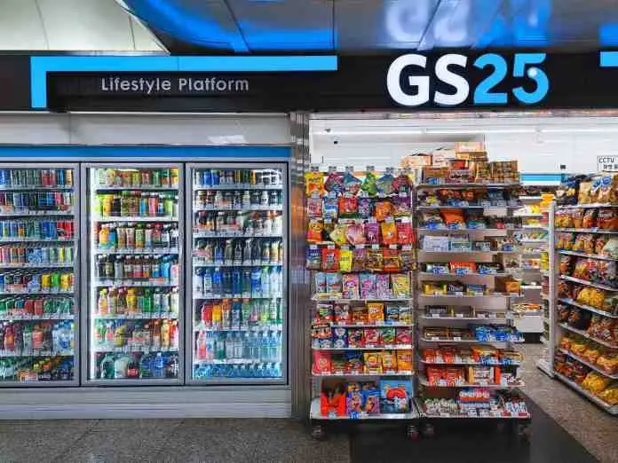 Interior view of a GS25 convenience store featuring a refrigerated beverage display and snack shelves, under a sign that reads 'Lifestyle Platform'.