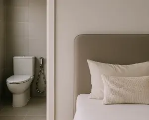 Absolutely do not position your bed so that the foot of the bed faces the toilet, otherwise you risk encountering this!