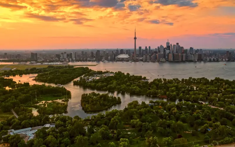 The iconic CN Tower and city skyline, as seen from the Toronto Islands - Simonkr/E+