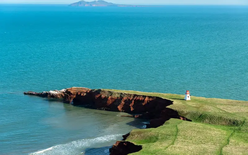 Wild beaches, honeyed sandstone cliffs and red-topped lighthouses dominate Quebec’s Magdalen Islands - Etienne St-Pierre/iStockphoto