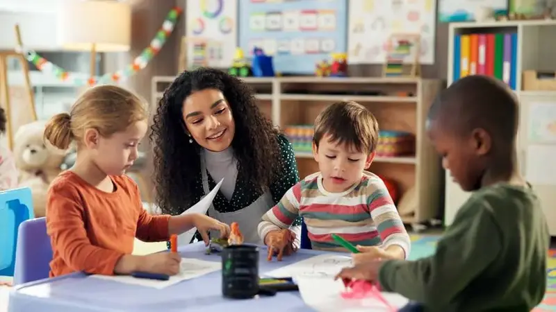 Teacher with students in a classroom
