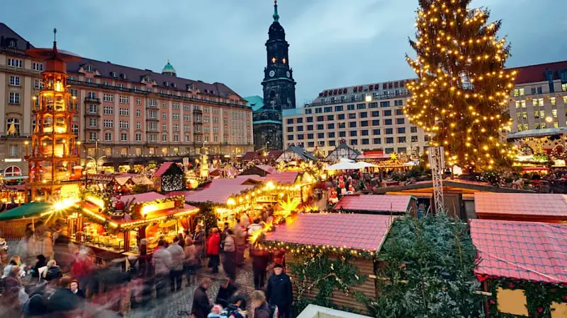Striezelmarkt (Christmas market) in Dresden illuminated at dusk