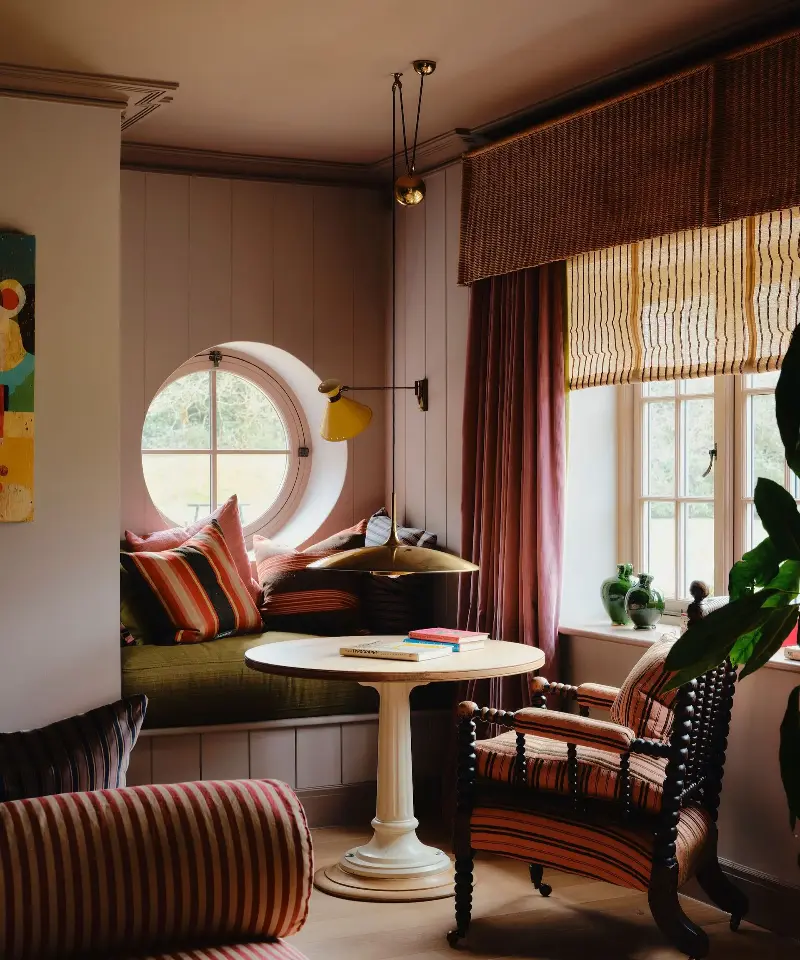 Use lighting to create a cozy reading corner within your living room. (Image credit: Dean Hearne)