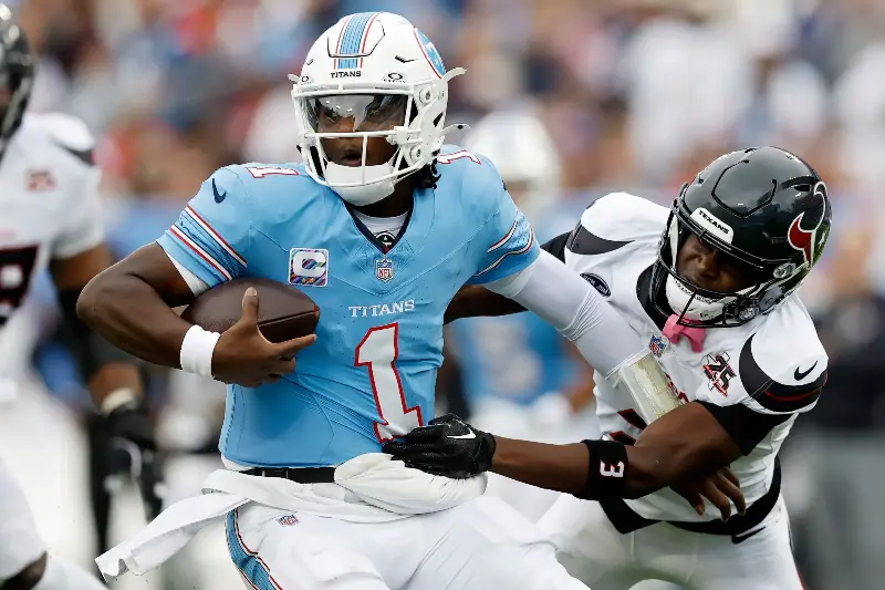 Kamari Lassiter #3 of the Houston Texans attempts to tackle Cam Ward #1 of the Tennessee Titans during the first quarter of the game at Nissan Stadium on October 11, 2026 in Nashville, Tennessee. (Photo by Justin Ford/Getty Images)