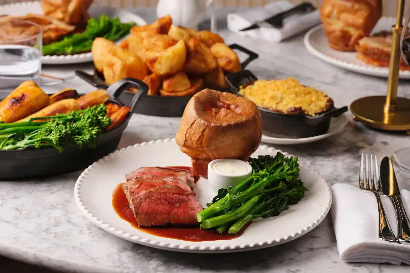 Abé keeps the bones of the Sunday roast intact – crisp potatoes, Yorkshire pudding and proper gravy – but makes a case for ketchup with her roasted tomato version (Sally Abe/Light Speed)