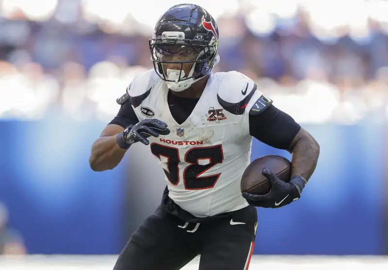 David Montgomery #32 of the Houston Texans runs the ball during the first half against the Indianapolis Colts at Lucas Oil Stadium on September 27, 2026 in Indianapolis, Indiana. (Photo by Michael Hickey/Getty Images)