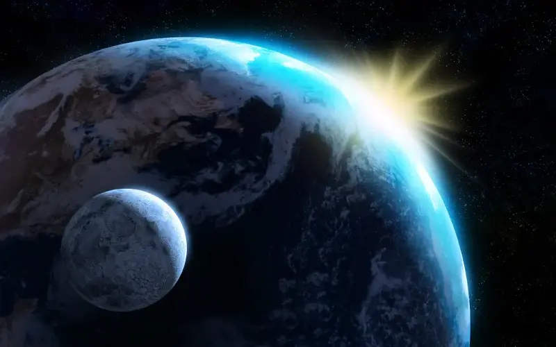 A rendering of the sun illuminating the Earth and the moon.
