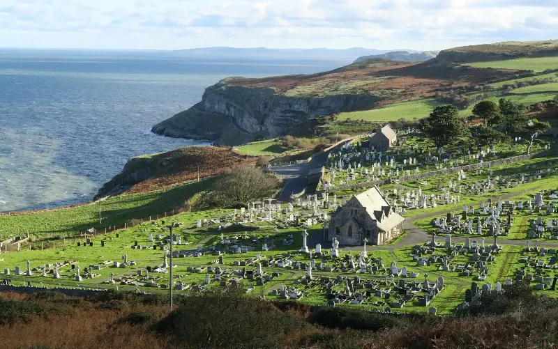 The church of St Tudno’s is a place of pilgrimage on a windswept slope - iStockphoto