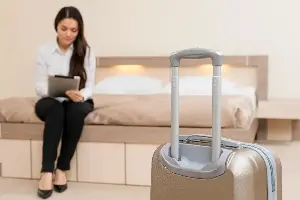 Why should travelers take photos as soon as they check into their hotel room?