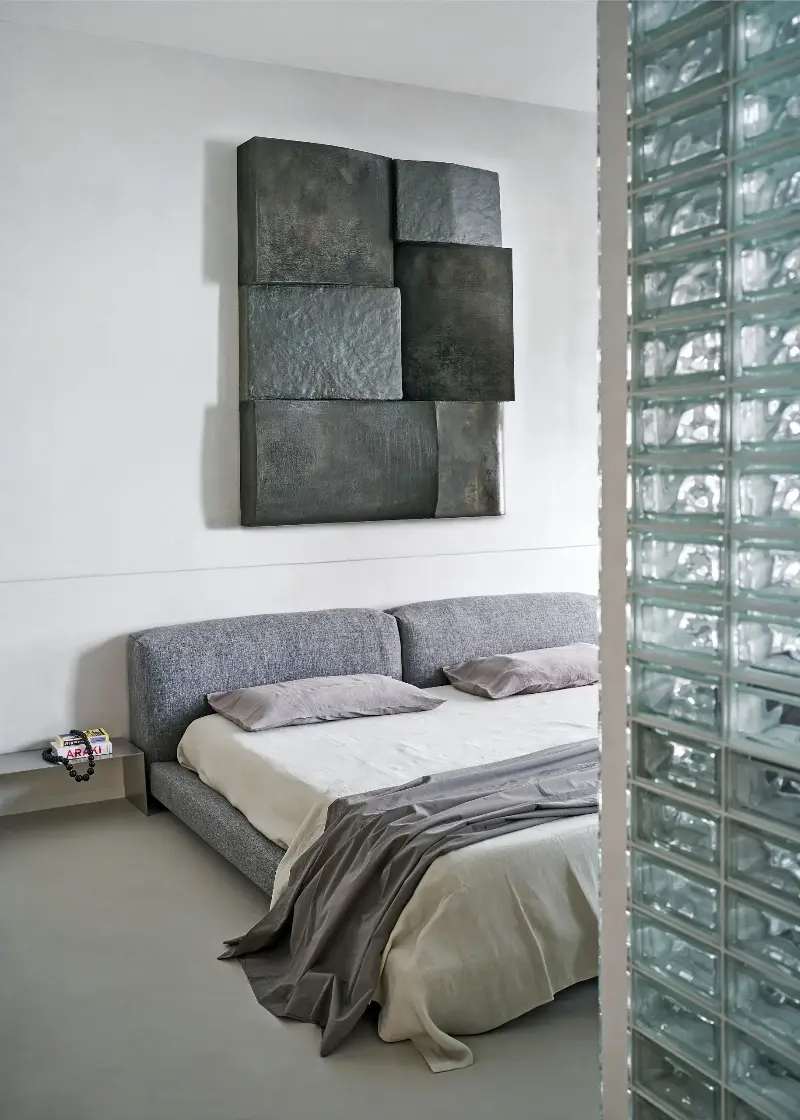 The glass bricks of the walk-in wardrobe at the center of the apartment evoke the design spirit of the early 80s. (Image credit: Francesco Dolfo/Living Inside. Styling: Giulia Taglialatela)