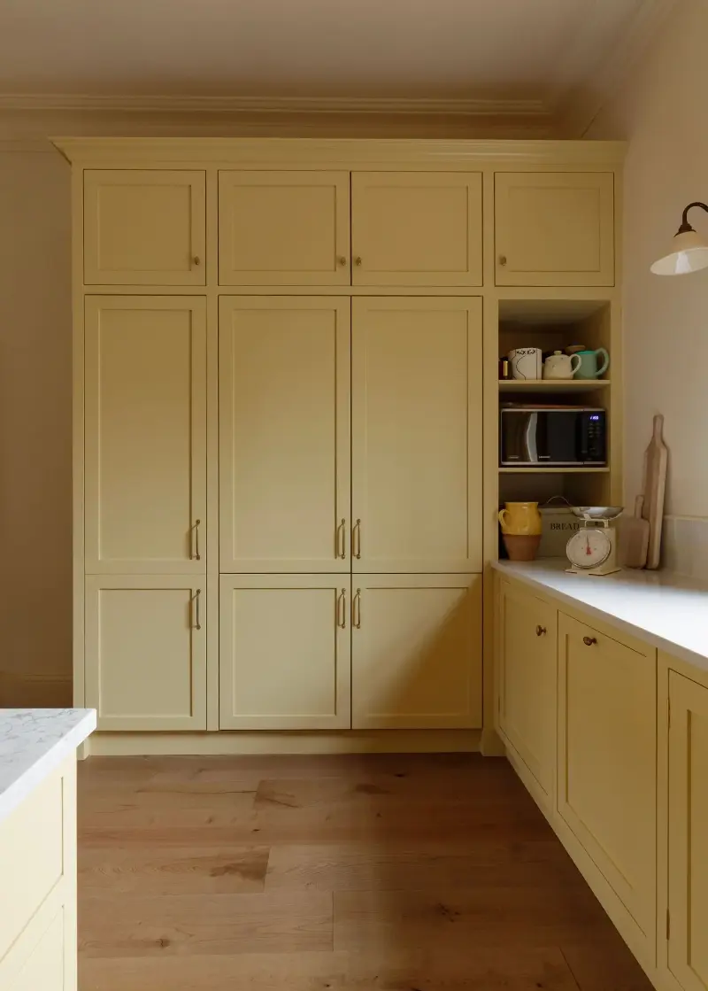 Choosing the right paint shade is key to making butter yellow feel timeless —&nbsp;anything too sweet or pastel can quickly date, while earthy and hushed shades feel timeless.  (Image credit: Alexander Baxter. Design: Studio Mac)