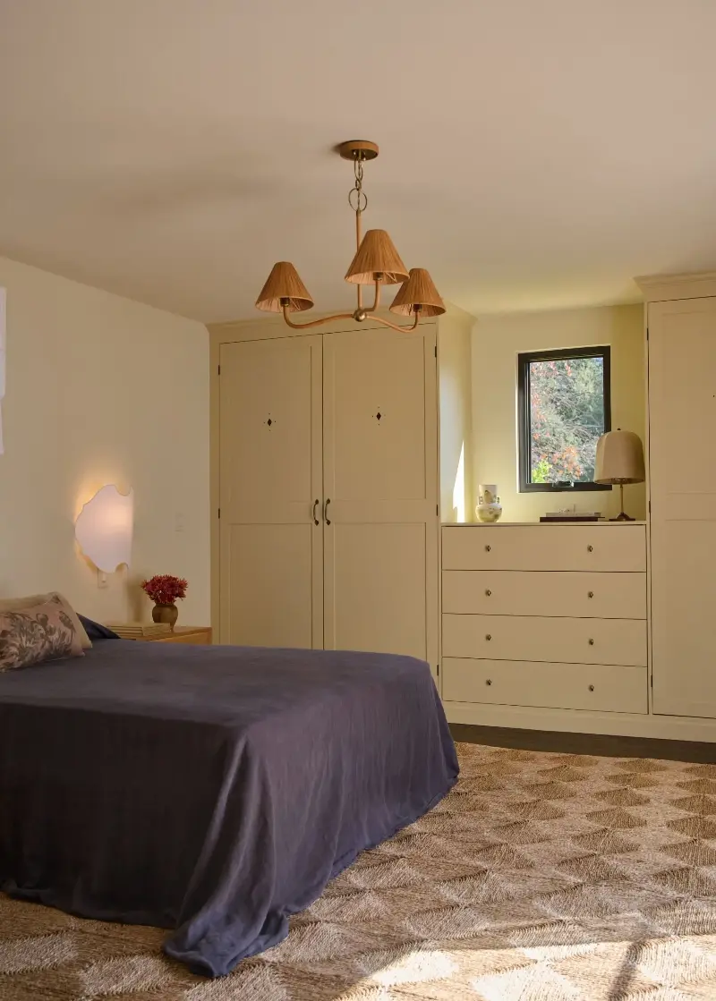 In this bedroom, Farrow & Ball's Hay was used on the joinery, teamed with Lime White on the walls. 