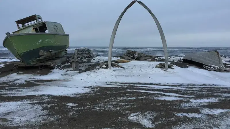 The snow-dusted Whale Bone Arch in Utqiaġvik, Alaska, during its sunless winter polar night.
