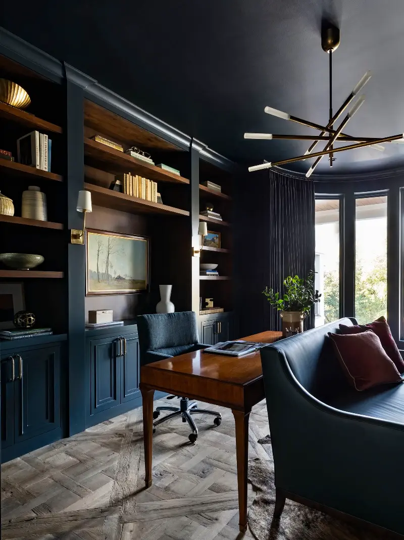 Having lighting on a bookcase or built into the furniture makes the scheme feel less direct and harsh. (Image credit: Julie Soefer. Design: Marie Flanigan Interiors)