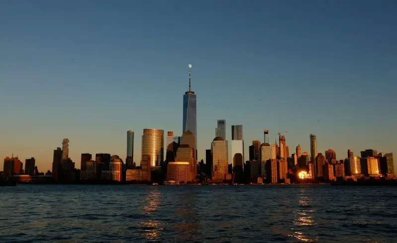 The skyline of lower Manhattan and One World Trade Center as the sun sets in New York City on October 22, 2026, as seen from Jersey City, New Jersey.