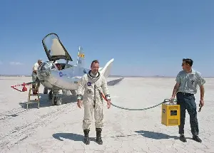 At about 19 kilometres up the air pressure falls low enough that water boils at human body temperature, so an unprotected person there would feel the saliva on their tongue turn to vapour, which is why aircrew above that altitude wear sealed pressure suits rather than an oxygen mask