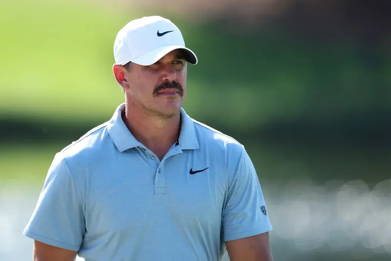 GREENSBORO, NORTH CAROLINA - AUGUST 06: Brooks Koepka of the United States looks on from the 15th green during the first round of the Wyndham Championship 2026 at Sedgefield Country Club on August 06, 2026 in Greensboro, North Carolina. (Photo by Caleb Bowlin/Getty Images)