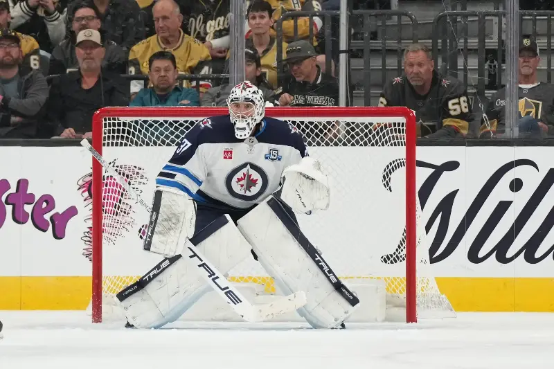 Connor Hellebuyck #37 of the Winnipeg Jets defends the net against the Vegas Golden Knights in the third period of their game at T-Mobile Arena on April 13, 2026 in Las Vegas, Nevada. The Golden Knights defeated the Jets 6-2. (Photo by Candice Ward/Getty Images)