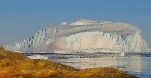 Rare moment: Giant iceberg flips over, revealing its deep blue 'belly'.