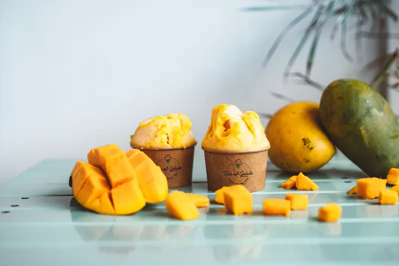 Mango yoghurt parfait is a simple yet elegant dessert that layers fresh mango cubes with chilled Greek Yoghurt and a sprinkle of granola.