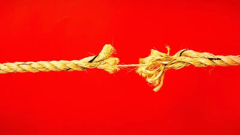 Hanging by a thread: frayed rope about to break