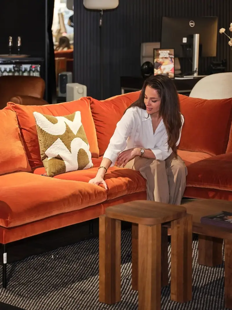 Testing Heal’s Matera sofa, pressing the seat cushion to assess its softness and support.Victoria Erdelevskaya
