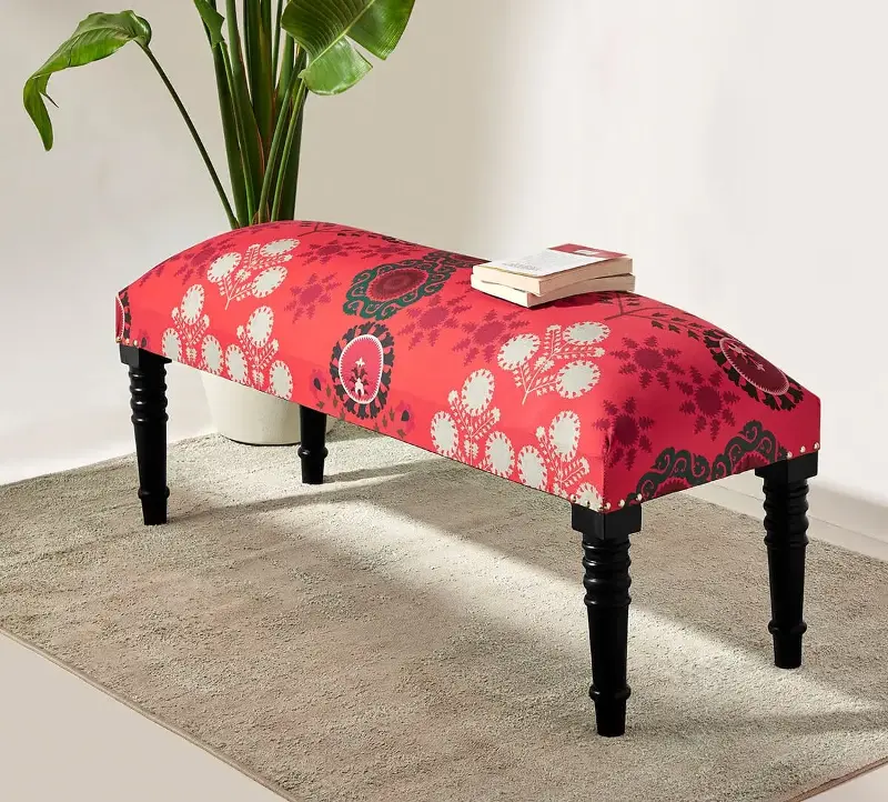 An ottoman, pouffe or compact side table can be both practical and decorative. 