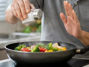 Eating less salt: Lower blood pressure, and benefits for the heart and kidneys?
