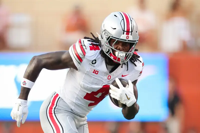 AUSTIN, TEXAS - SEPTEMBER 12: Jeremiah Smith #4 of the Ohio State Buckeyes runs the ball against the Texas Longhorns during the first quarter at Darrell K Royal-Texas Memorial Stadium on September 12, 2026 in Austin, Texas. (Photo by Alex Slitz/Getty Images)