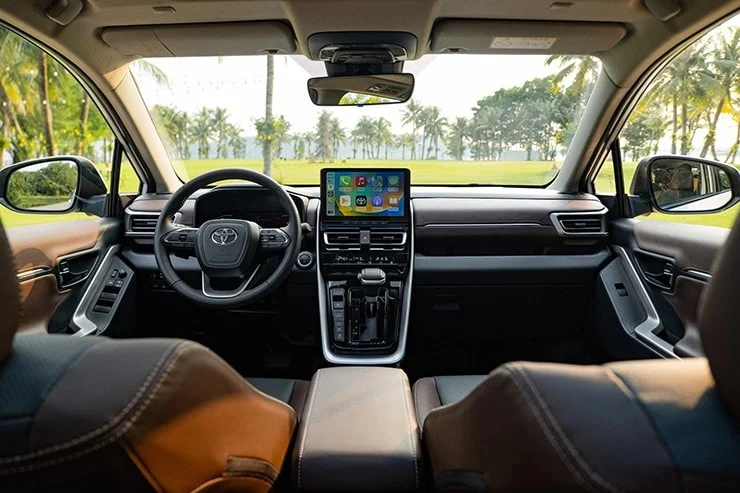 The Toyota Innova Cross interior features a modern, floating display screen.