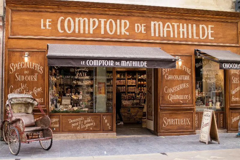 Traditional French storefront of Le Comptoir de Mathilde in Bordeaux, offering local delicacies.