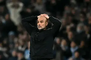 Pep Guardiola reacts after Man City lose ground on Arsenal in Premier League title race