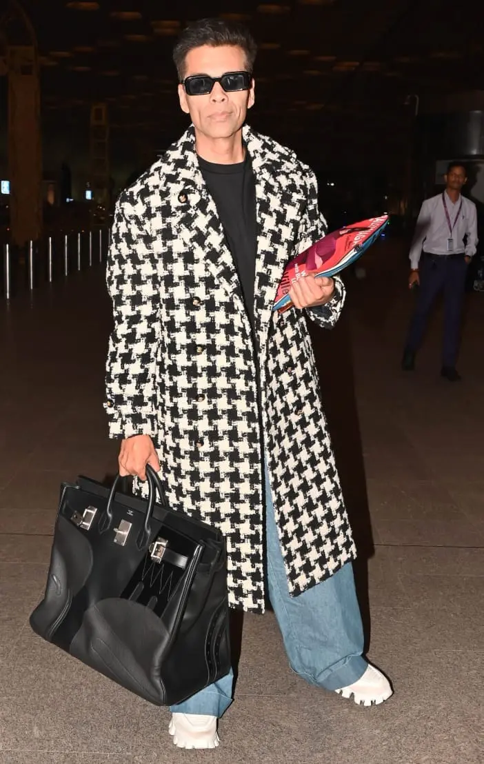 KJo nails winter layering in a houndstooth overcoat