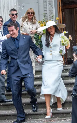 Dua Lipa pays homage to Bianca Jagger in sleek wedding tailoring