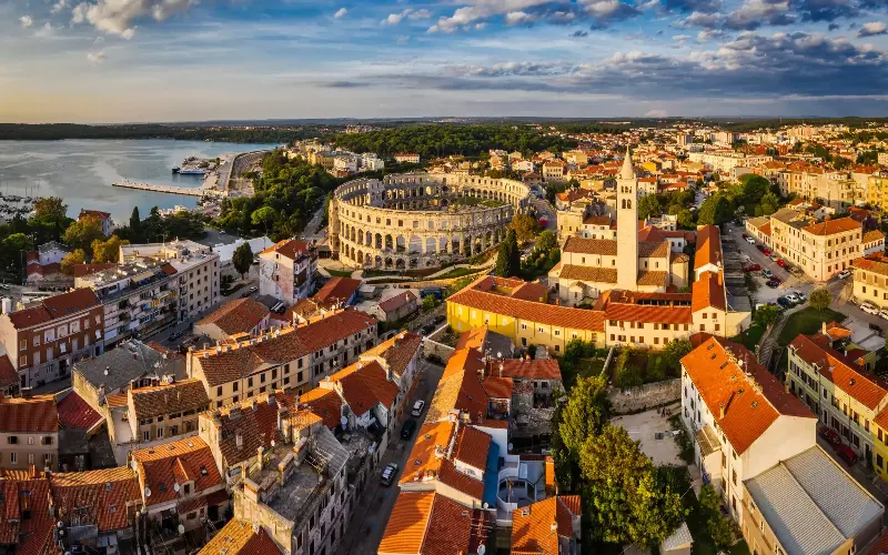 Milder temperatures paired with delicious food and wine make Pula an ideal autumn destination - Moment RF/Ratnakorn Piyasirisorost