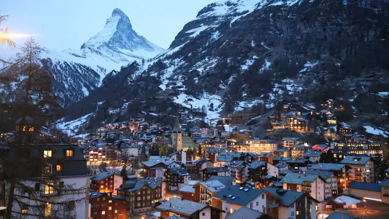 Zermatt, Switzerland, a lit-up village in the mountains