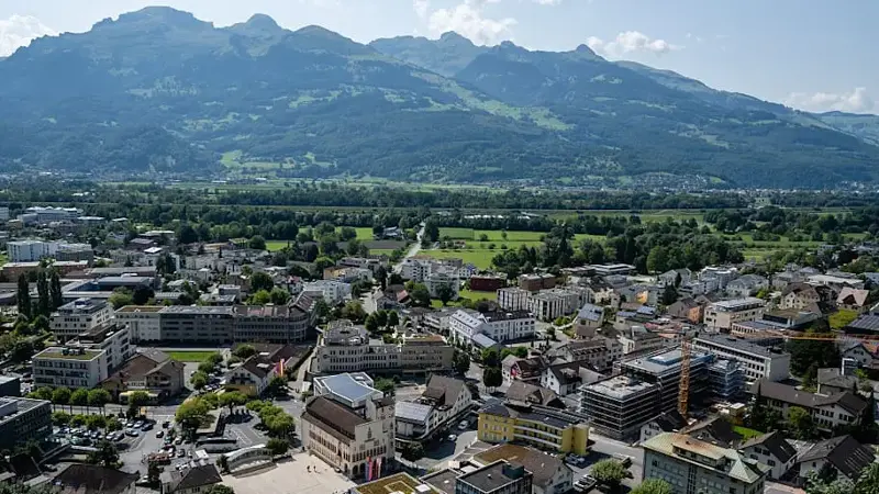 General view of Vaduz from the hill with mountain range of
