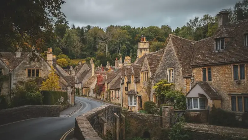 Row of stone cottages in Castle Combe, located in the Cotswolds.