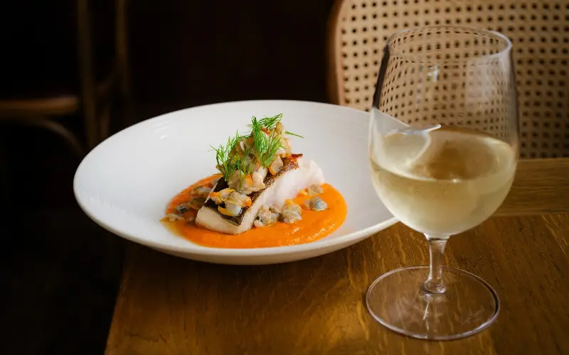 The cod was served in an ‘overwhelming pond of romesco sauce’