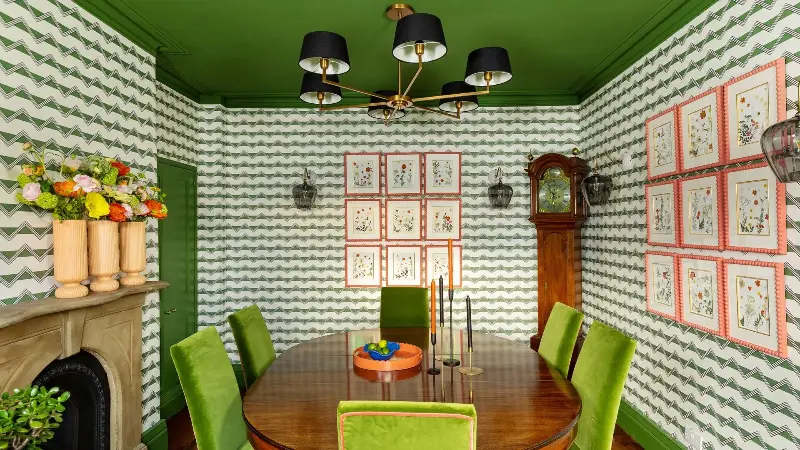 This green dining room designed by Jo is the perfect example of how she uses bolder colour to give timeless, traditional spaces something of the unexpected. (Image credit: Jo Bee)