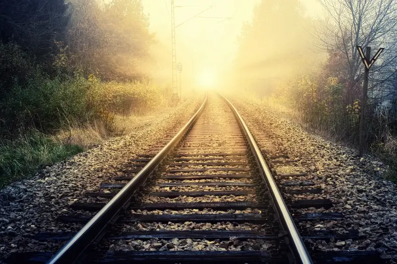 Track ballast consists of crushed, angular stones placed beneath railway sleepers. 