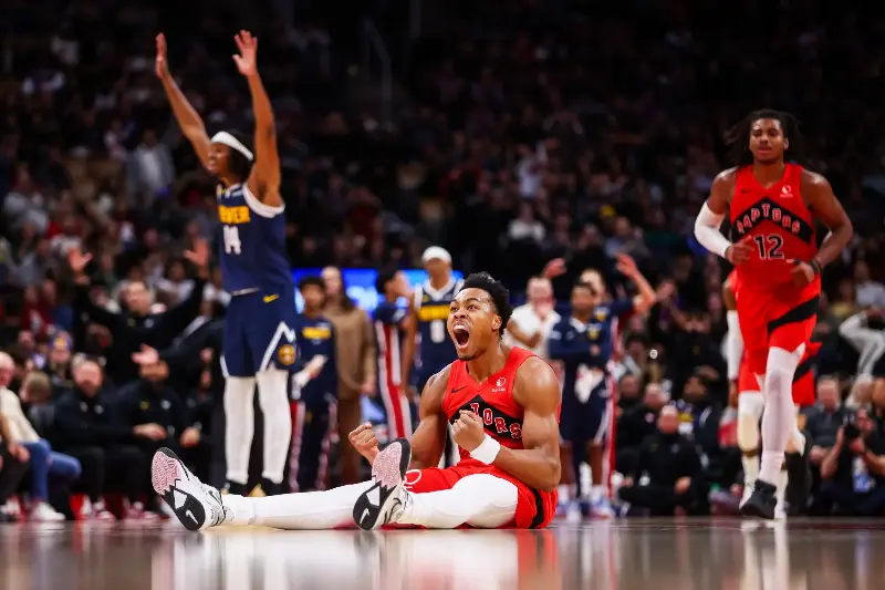 TORONTO, CANADA - DECEMBER 31: Scottie Barnes #4 of the Toronto Raptors reacts on the ground during second half of their NBA game against the Denver Nuggets at Scotiabank Arena on December 31, 2025 in Toronto, Ontario, Canada. (Photo by Cole Burston/Getty Images)