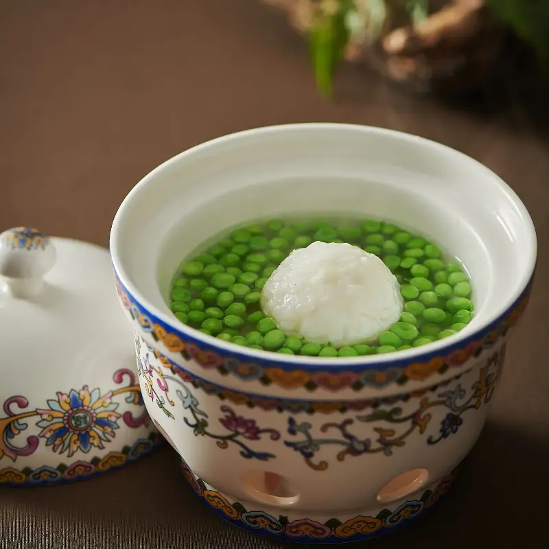 Stewed yellow croaker meatballs with crab and sweet peas.