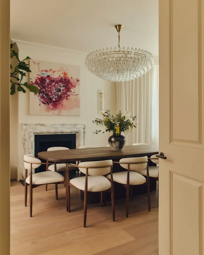 The formal dining room has a fireplace and features a commissioned art piece by Elizabeth Abel.Studio Hahn. Design: Gangar