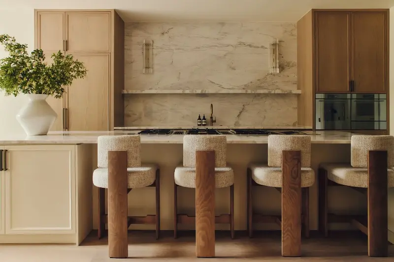 The fully bespoke kitchen features a generous central island with a marble backsplash and worktop.  (Image credit: Studio Hahn. Design: Gangar)