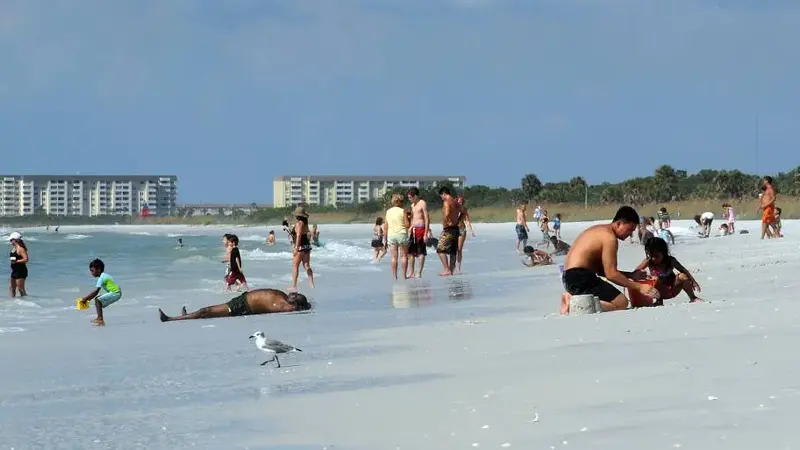 Visitors relax along the shore at Caladesi Island State Park