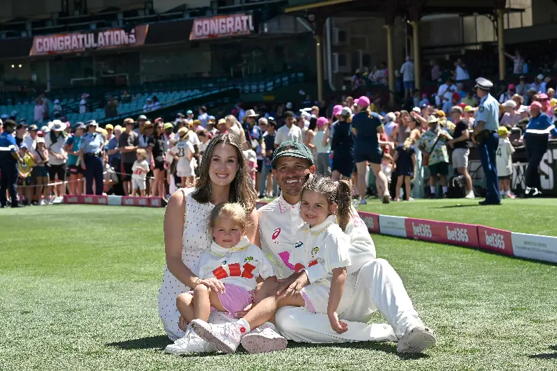 Australia's Usman Khawaja poses for pictures with his family after his final international game at SCG. 