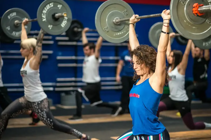 Stock image: A fitness community of students learning weightlifting techniques during a gym class in the Italian gym Gym 
