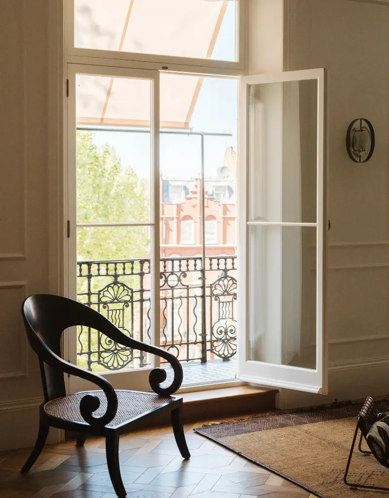 The dramatic windows in the living room allow for a stunning wash of natural light, making the whole space feel brighter and more inviting.Ellen Hancock, Delve Architects