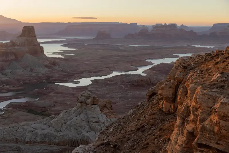 Land and geologic formations that have been underwater since the 1960s, when Lake Powell was created, reemerge for the first time while record low water levels continue to drop on September 4, 2026 near Page, Arizona.